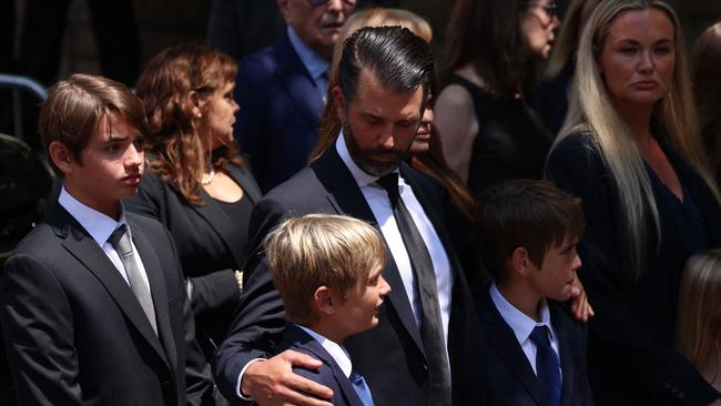 Donald Trump Jr comforts children at the funeral of his mother, Ivana Trump. Picture: AFP