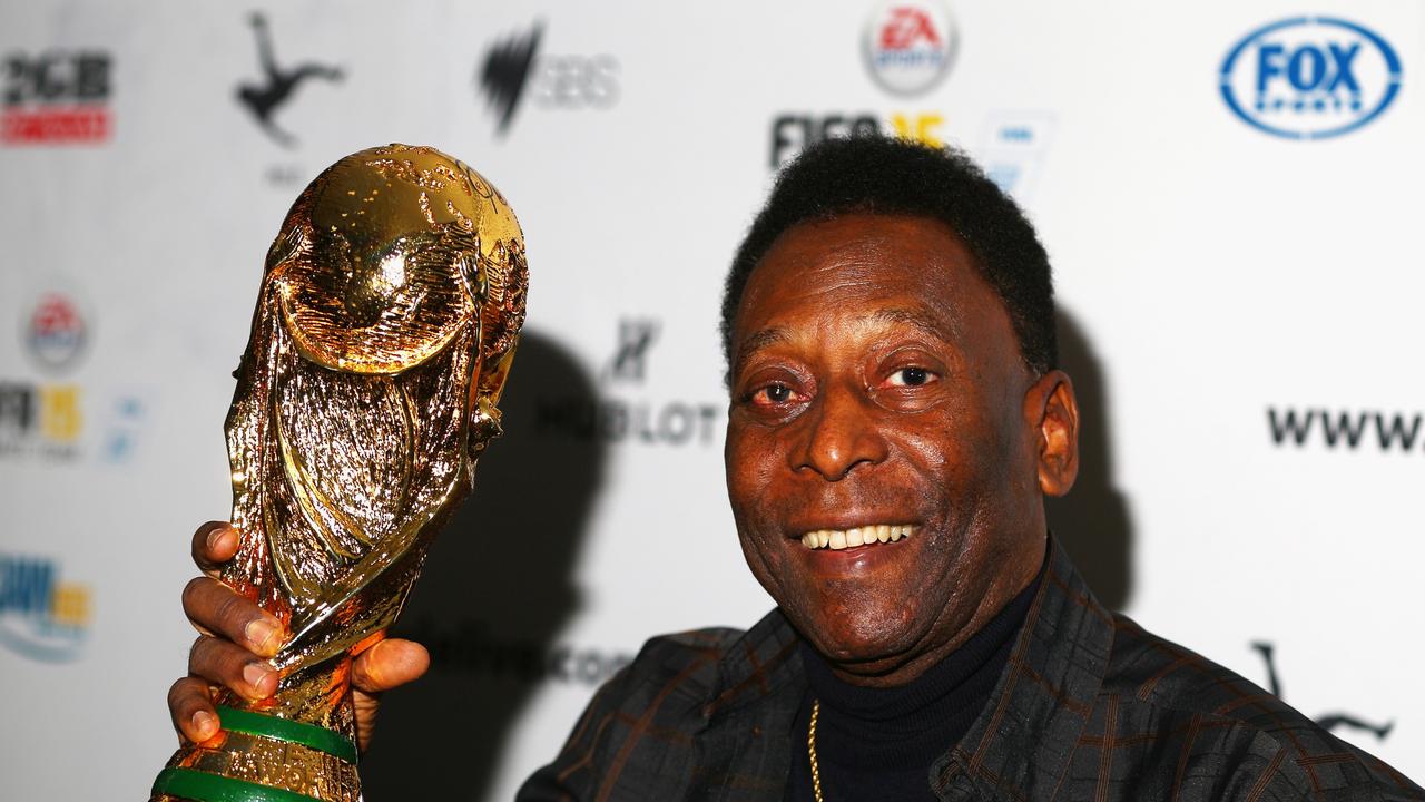 FILE - DECEMBER 29, 2022: It was reported that football star Pele, who was undergoing treatments for colon cancer, died at the age of 82. MELBOURNE, AUSTRALIA - MARCH 26: Pele holds a replica Wolrd Cup trophy during a press conference at The Peninsula on March 26, 2015 in Melbourne, Australia. (Photo by Robert Cianflone/Getty Images)