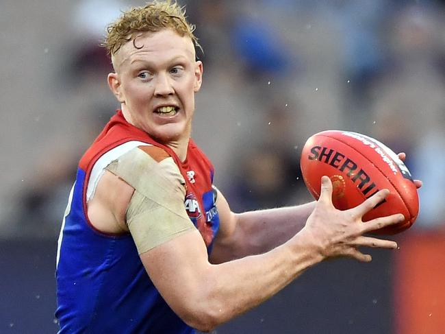 Clayton Oliver of the Demons is seen in action during the Round 16 AFL match between the Carlton Blues and the Melbourne Demons at the MCG in Melbourne, Sunday, July 7, 2019. (AAP Image/Julian Smith) NO ARCHIVING, EDITORIAL USE ONLY