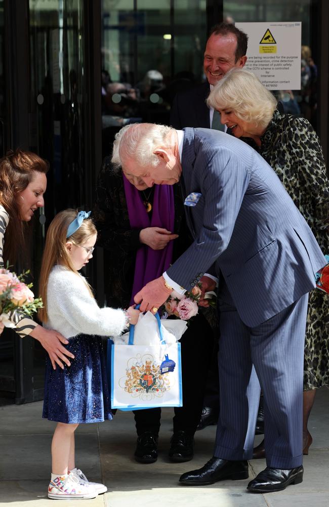 The monarch gave the child his own gift in return. Picture: Getty Images