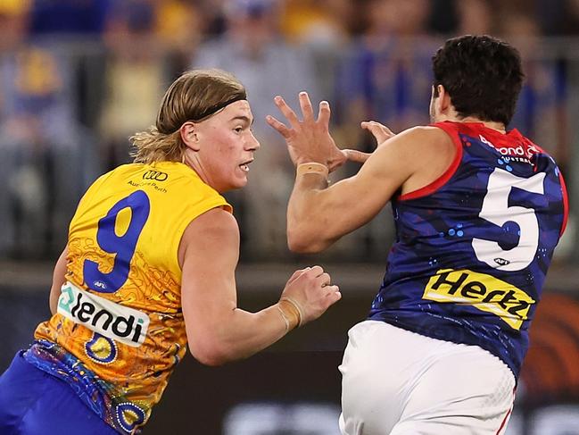 PERTH, AUSTRALIA - MAY 19: Harley Reid of the Eagles fends off Christian Petracca of the Demons during the round 10 AFL match between Waalitj Marawar (the West Coast Eagles) and Narrm (the Melbourne Demons) at Optus Stadium, on May 19, 2024, in Perth, Australia. (Photo by Paul Kane/Getty Images)