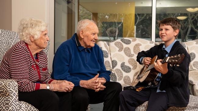 Selina Taylor, Barry Dunn and Jeremy Doyle at Southern Cross Care’s nursing home in Daceyville during a visit from students at St Andrew's Catholic Primary School Malabar. Picture: Monique Harmer