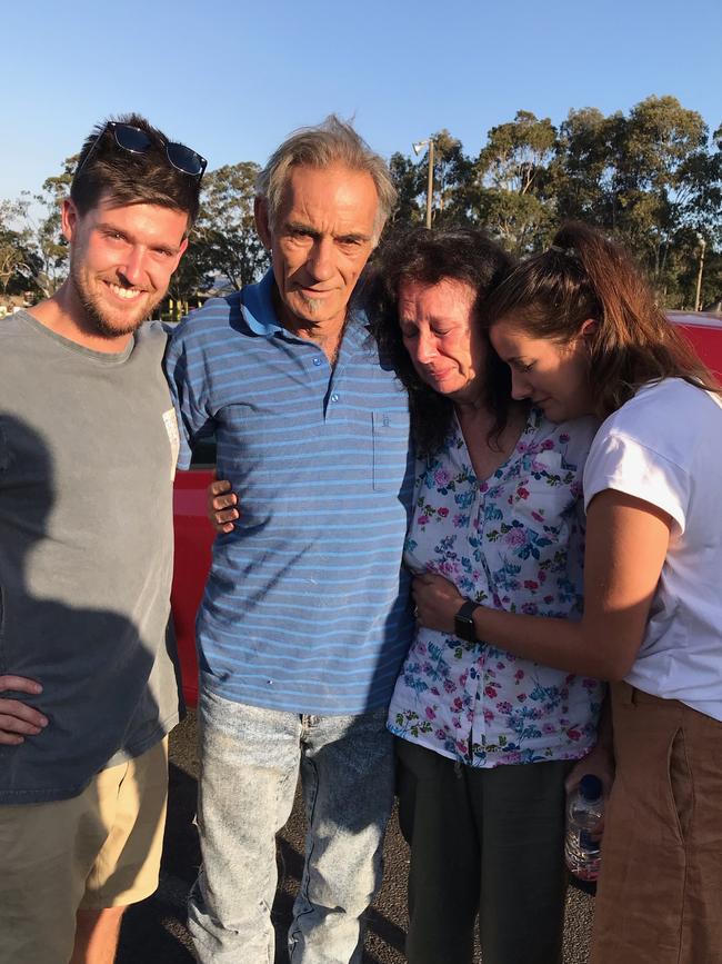 Dennis and Mary Gilbert are reunited with daughter Hannah and her fiance Luke after fire tore through their Buchan house. Picture: Supplied