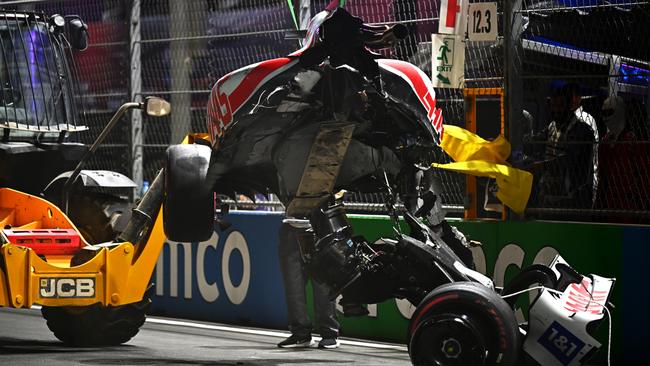 The car of Mick Schumacher of Germany and Haas F1 is removed from the track
