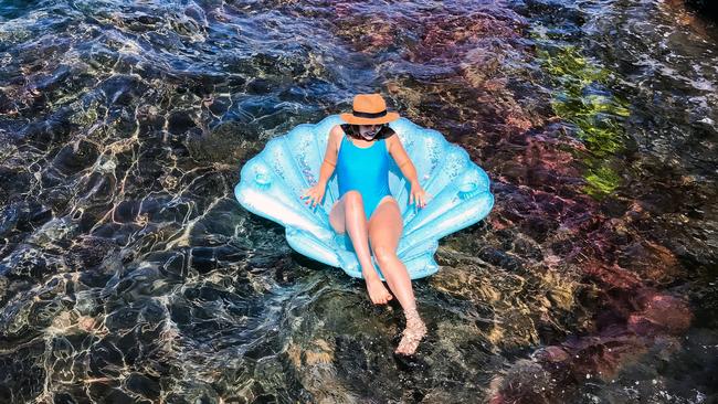 Sydney writer and yogi Phoebe Loomes cools off in the Giles Baths at Coogee. Picture: Nicholas Eagar