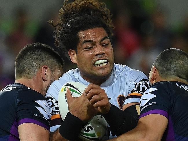 Adam Blair of the Broncos (centre) and Jesse Bromwich (left) and Will Chambers of the Storm contest during the first NRL preliminary final between the Melbourne Storm and the Brisbane Broncos at AAMI Park in Melbourne, Friday, September 22, 2017. (AAP Image/Julian Smith) NO ARCHIVING, EDITORIAL USE ONLY