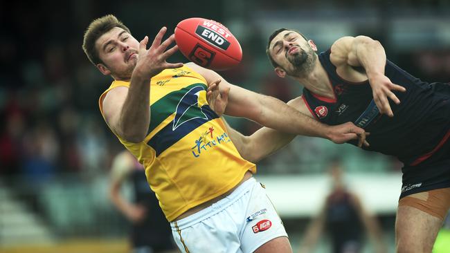 29/08/15 - Norwood v Eagles at Coopers' Stadium in Norwood. Eagles' Michael Wundke and Norwood's Alexis Greorgiou compete for the ball. Photo Tom Huntley