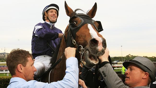 Hugh Bowman returns to scale after winning The Metropolitan aboard Seville. Picture: Mark Evans