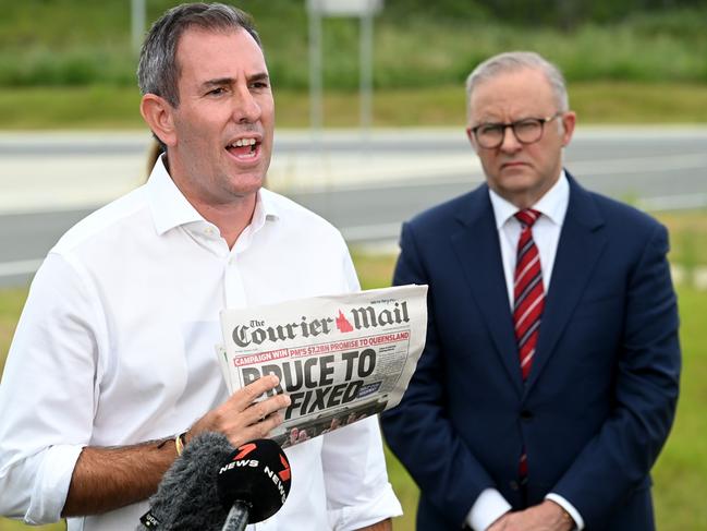 Treasurer Jim Chalmers holds Monday’s Courier-Mail as Bruce Highway funding is confirmed with Prime Minister Anthony Albanese. Picture: John Gass/NCA NewsWire