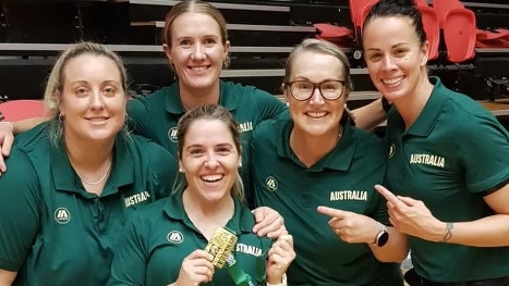 NT physio Bridie Duggan (bottom row) celebrating after the Gems won gold, defeating New Zealand, claiming the 2023 FIBA U17 Oceania Championship Title. Picture: Contributed.