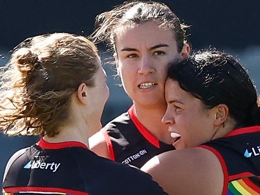 MELBOURNE, AUSTRALIA - OCTOBER 28: (L-R) Georgia Nanscawen, Bonnie Toogood and Madison Prespakis of the Bombers celebrate during the 2023 AFLW Round 09 match between The Essendon Bombers and The Carlton Blues at Windy Hill on October 28, 2023 in Melbourne, Australia. (Photo by Michael Willson/AFL Photos via Getty Images)