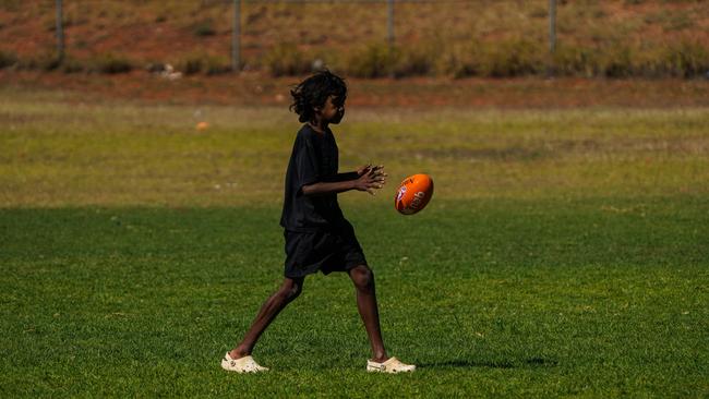 Melbourne Demons players Shane McAdam and Andy Moniz-Wakefield went to Santa Teresa ahead of the 2025 AFL game in Alice Springs. Picture: Melbourne Demons