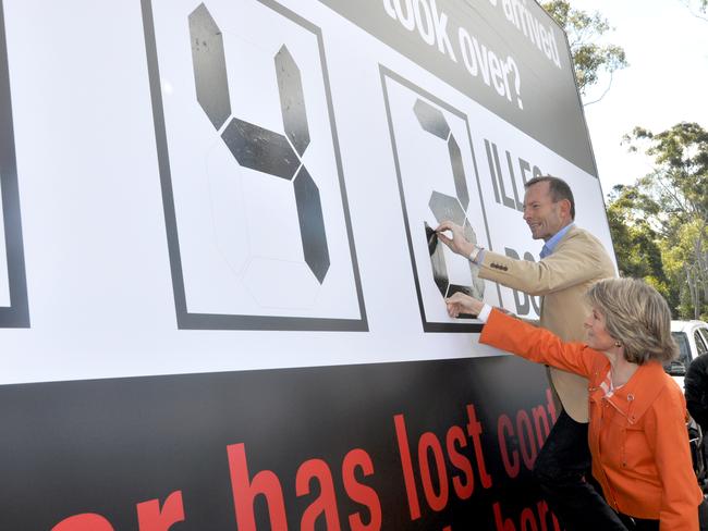 Then opposition leader Tony Abbott and opposition deputy leader Julie Bishop in Perth unveiling the latest figure of asylum seeker boats on a billboard. Picture: AAP