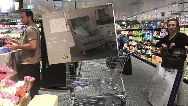 Shoppers balanced the chairs on trolleys.