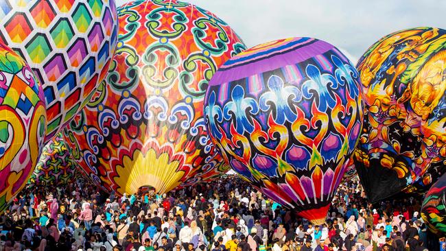 Participants prepare hot air balloons for the annual festival in Wonosobo, Central Java, held since 1950 during Eid al-Fitr. Picture: Devi Rahman/AFP