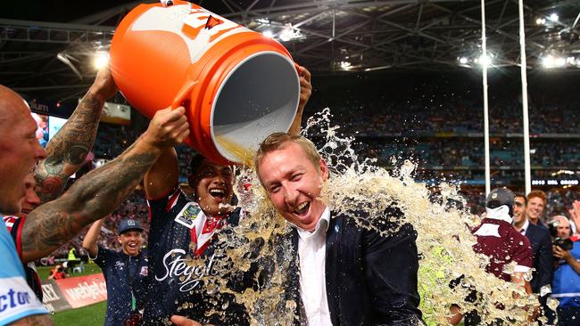 Roosters coach Trent Robinson gets a drenching after winning the 2013 Grand Final against Manly. Picture: Cameron Spencer/Getty Images.