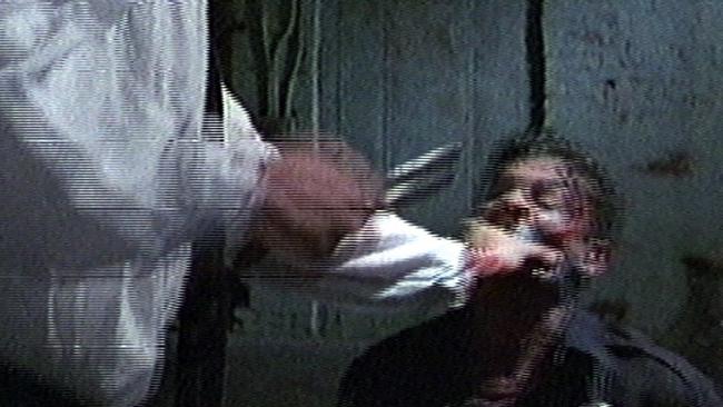 Video still featuring actor Michael Madsen ear cutting scene from 1992 film "Reservoir Dogs". Madsen/Actor