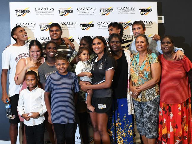 Palmerston star Janet Baird with her ecstatic family after getting picked up by Gold Coast Suns in the 2020 AFLW Draft. Picture: Katrina Bridgeford