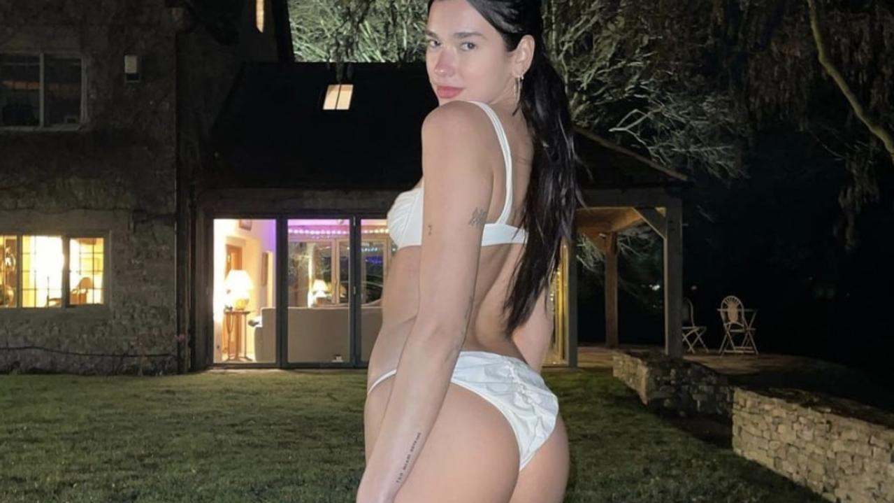 Dua Lipa has given fans a glimpse inside her pre-Christmas Cotswolds holiday as she stripped down to a bikini for a night time hot tub dip.