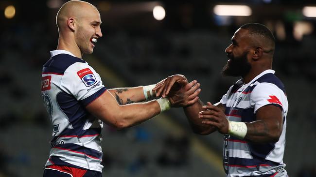 AUCKLAND, NEW ZEALAND - JUNE 02:  Billy Meakes of the Rebels celebrates with Marika Koroibete of the Rebels after scoring a try during the round 16 Super Rugby match between the Blues and the Rebels at Eden Park on June 2, 2018 in Auckland, New Zealand.  (Photo by Hannah Peters/Getty Images)