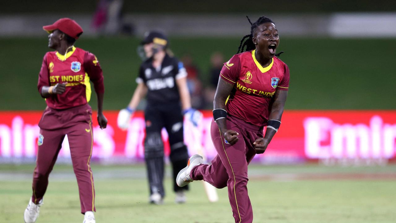 West Indies Deandra Dottin (R) celebrates team's victory after a run out of New Zealand's Fran Jonas during the Round 1 Women's Cricket World Cup match between New Zealand and the West Indies at Bay Oval in Mount Maunganui on March 4, 2022. (Photo by MICHAEL BRADLEY / AFP)