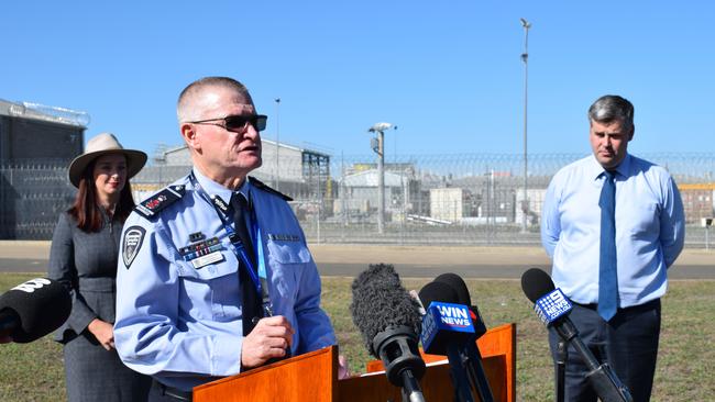 Commissioner Peter Martin with Member for Keppel Brittany Lauga and Minister for Correctional Services Mark Ryan.