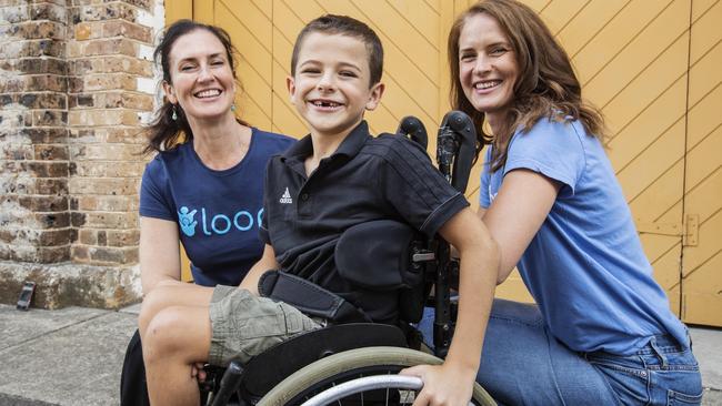 Kath Hamilton, Evander Conroy, 7, and Clare Conroy with the Loop+-designed wheelchair. Picture: Hollie Adams. 