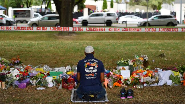 A Muslim worshipper prays at a makeshift memorial at the Al Noor Mosque in Christchurch, New Zealand. Picture: AAP Image/Mick Tsikas