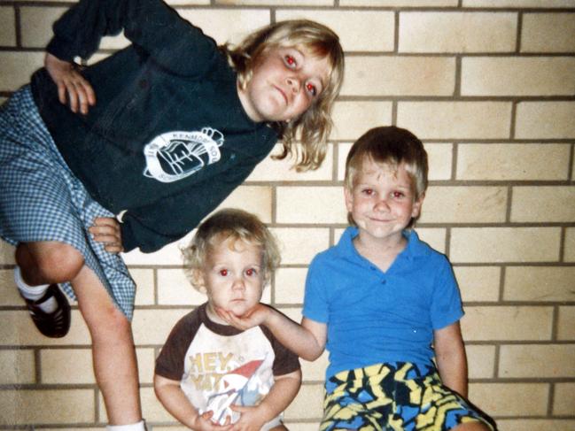 Comedian Josh Thomas (seated middle) and his brother Drew Thomas, and sister Nikki Thomas in a childhood photo from 1987.