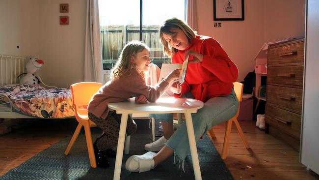 National education correspondent Rebecca Urban home-schooling her five-year-old daughter Margot before school resumes. Picture: Aaron Francis