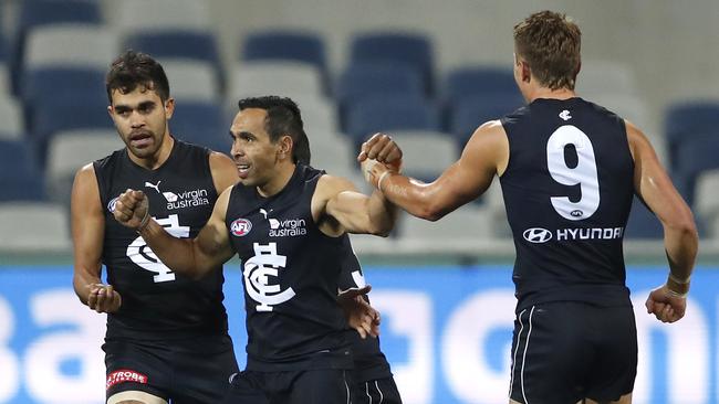 Eddie Betts of the Blues celebrates a goal with Jack Martin (L and Patrick Cripps of the Blues (R) during the Round 3 AFL match between the Geelong Cats and the Carlton Blues at GMHBA Stadium in Melbourne, Saturday, June 20, 2020. (AAP Image/Dylan Burns) NO ARCHIVING, EDITORIAL USE ONLY