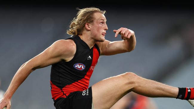 Essendon’s Mason Redman traded the footy for a bat and ball on Tuesday night. Photo: Michael Klein.