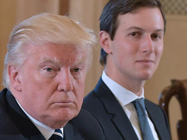 US President Donald Trump (L) and White House senior advisor Jared Kushner take part in a bilateral meeting with Italy's Prime Minister Paolo Gentiloni (not seen) in Villa Taverna, the US ambassador's residence, in Rome on May 24, 2017. After a private audience wit Pope Francis early in the morning Trump's family will fly to Brussels this afternoon for meetings with EU and NATO officials before returning to Italy for the G7 summit in Sicily on May 26-27. / AFP PHOTO / MANDEL NGAN