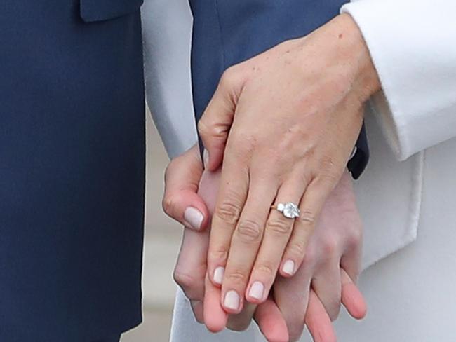 Meghan Markle showed off her engagement ring in London. Picture: AFP.