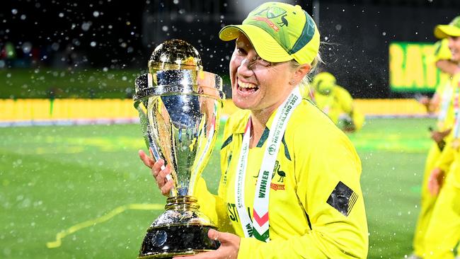 Alyssa Healy of Australia celebrates with the trophy after Australia won the 2022 ICC Women's Cricket World Cup Final match between Australia and England at Hagley Oval on April 03, 2022 in Christchurch, New Zealand. Picture: Hannah Peters/Getty Images