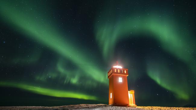 Aurora borealis, or the northern lights, above a lighthouse to the village of Grundarfjorour in Iceland. Aurorae are caused by the interaction between energetic charged particles from the sun and gas molecules in the upper atmosphere of the earth, about 100km above. Picture: AP