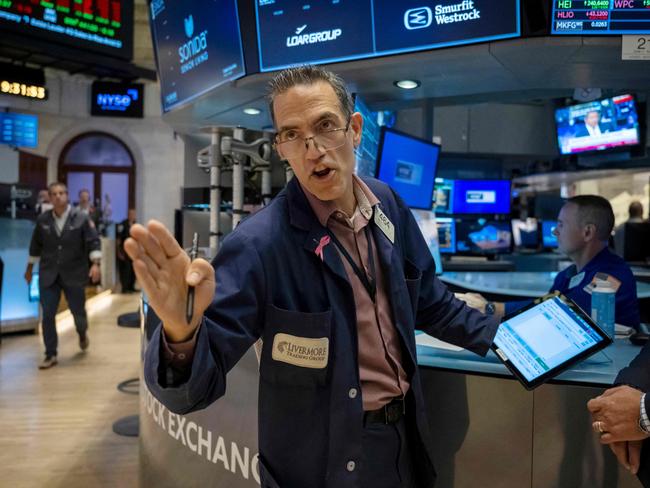 Traders work the floor of the New York Stock Exchange on August 16, 2024. US stocks edged lower in early trading Friday, as traders looked to lock in gains at the end of a positive week for major Wall Street indices. Around 10 minutes into trading, the Dow Jones Industrial Average was down 0.1 percent at 40,518.87, and the S&P was 0.1 percent lower at 5,536.08. The Nasdaq slipped 0.2 percent to 17,566.08. (Photo by ANGELA WEISS / AFP)