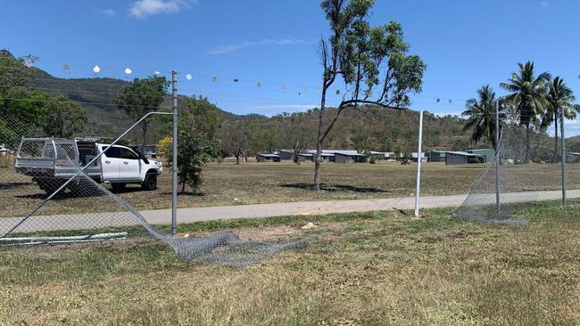 A woman has been hospitalised after her vehicle crashed through the fence at Lavarack Barracks following a three-car collision on University Road, Murray. Photo: Jami Roberts.