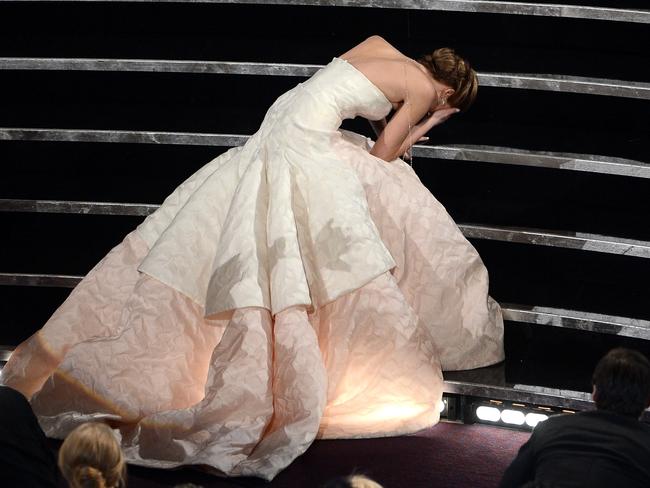 Jennifer Lawrence trips after winning the Best Actress award for “Silver Linings Playbook” during the Oscars held at the Dolby Theatre on February 24, 2013 in Hollywood, California. (Photo by Kevin Winter/Getty Images)