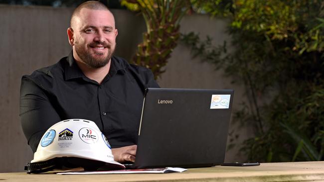 Former construction worker Simon Tyler gave up the industry to study psychology - now he is doing a PhD in suicidology to help is former mates in the industry. Picture: Naomi Jellicoe