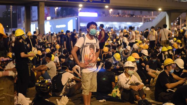 Demonstrators occupy a street the night after a protest against the extradition law.