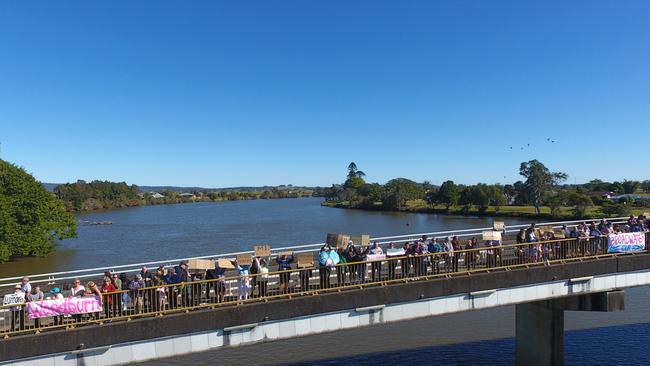 Crowds gather on the bridge by Woodburn Riverside Park to protest the response to the 2022 floods in the Richmond Valley. Picture: Jack Wood