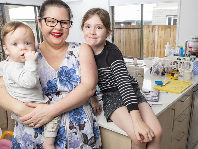 Newport mum of four Lou Smith who outsources cleaning, gardening and a virtual assistant, pictured at home with daughters Abi 14 months, and Caitlin 7. Picture Lachie Millard