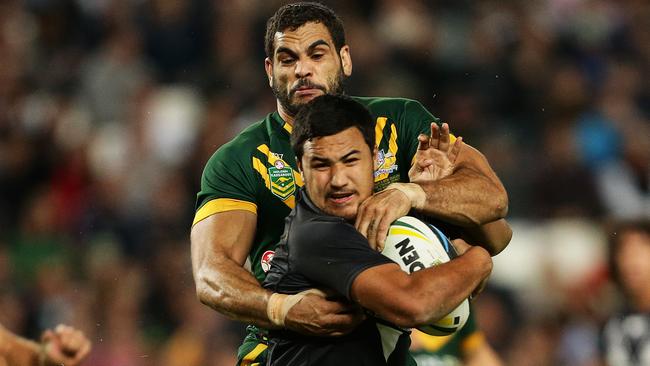 Australia's Greg Inglis tackles New Zealand's Peta Hiku during the rugby league Test Match between Australia and New Zealand at Allianz Stadium, Sydney. Pic Brett Costello