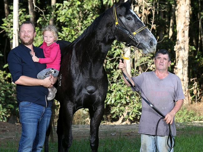 Race horse owner Chris Jorgensen and his daughter Athena with his horse Taveuni and Cairns Trainer Rodney Miller. PICTURE: STEWART MCLEAN