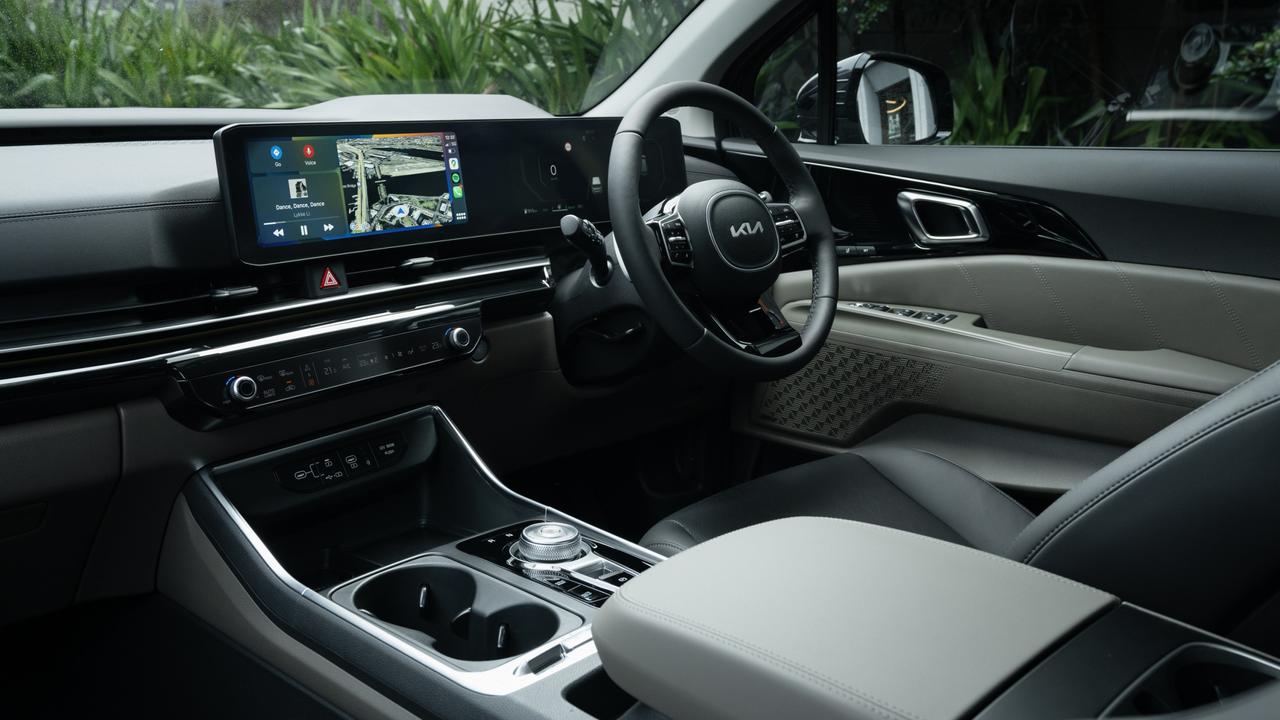 Among the cabin highlights of the Kia Carnival Hybrid are dual sunroof, two 12.3-inch screens which blend together, 12-speaker Bose stereo and wireless smartphone mirroring apps.