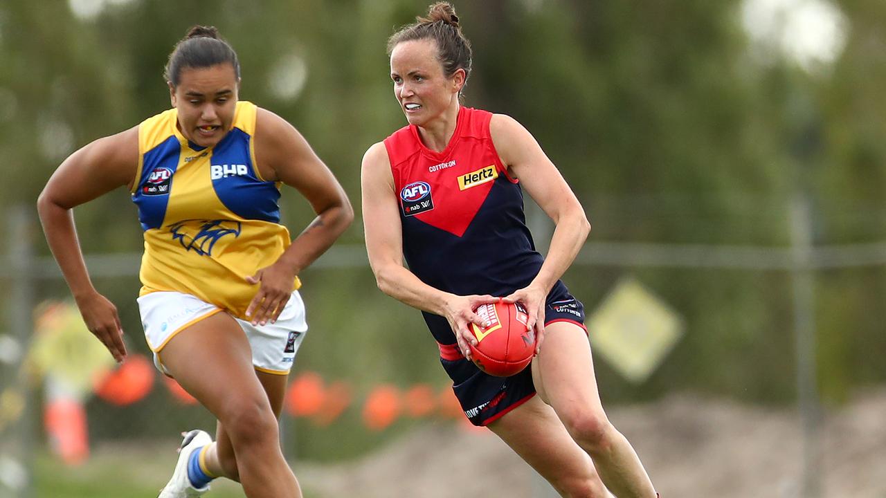 MELBOURNE, AUSTRALIA - MARCH 08: Daisy Pearce of the Demons runs with the ball during the round five AFLW match between the Melbourne Demons and the West Coast Eagles at Casey Fields on March 08, 2020 in Melbourne, Australia. (Photo by Kelly Defina/Getty Images)