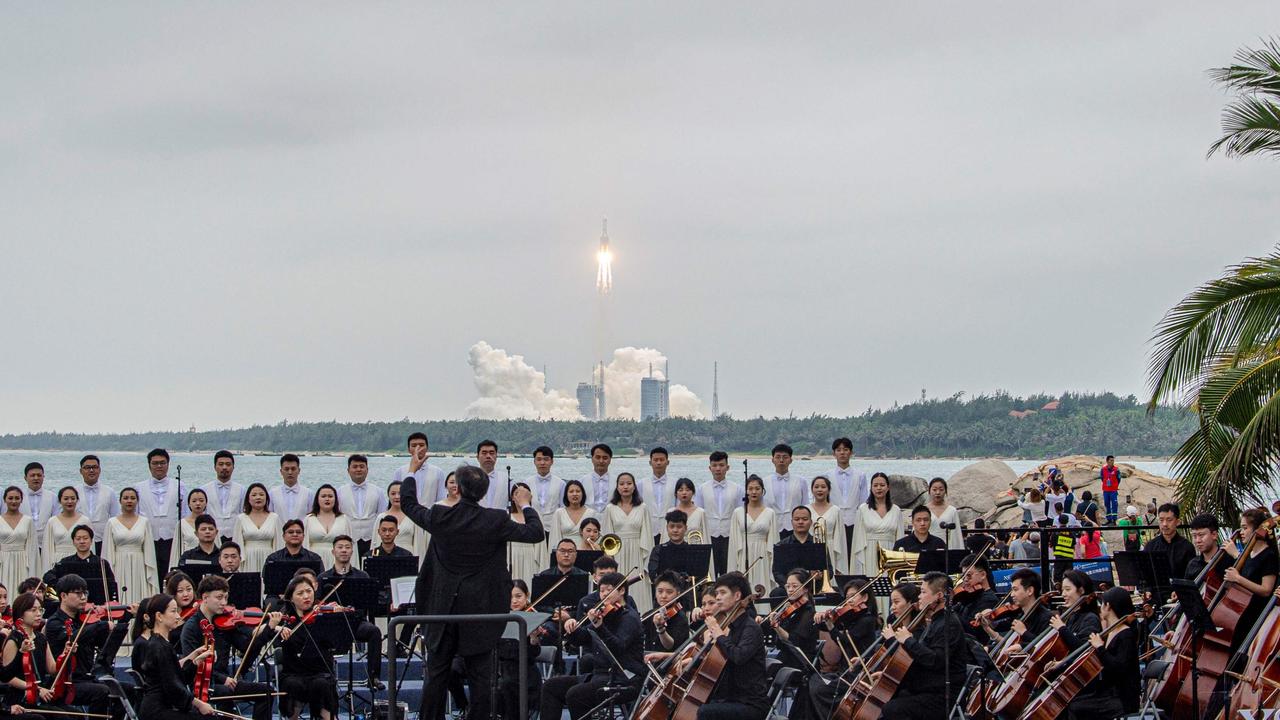 A band plays at the launch of the Long March 5B in China’s Hainan province. Picture: STR/AFP