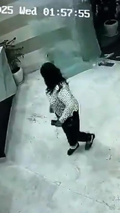 Furious resident smashes glass door to wake sleeping security guard