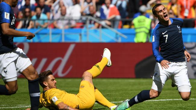 Josh Risdon takes down Antoine Griezmann.